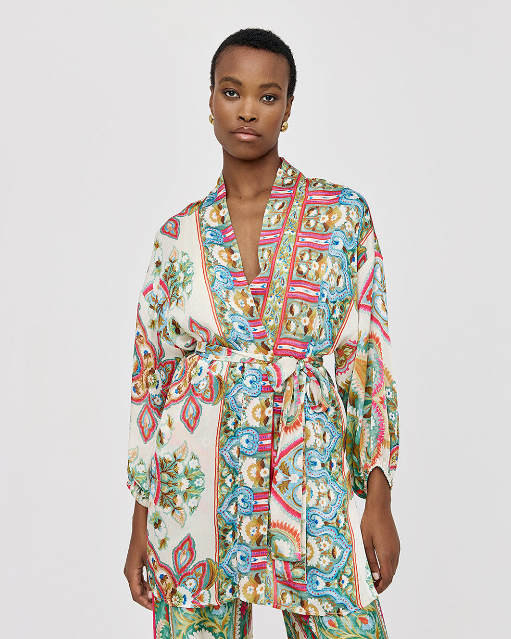 Blusa lunga stampata con cintura da annodare