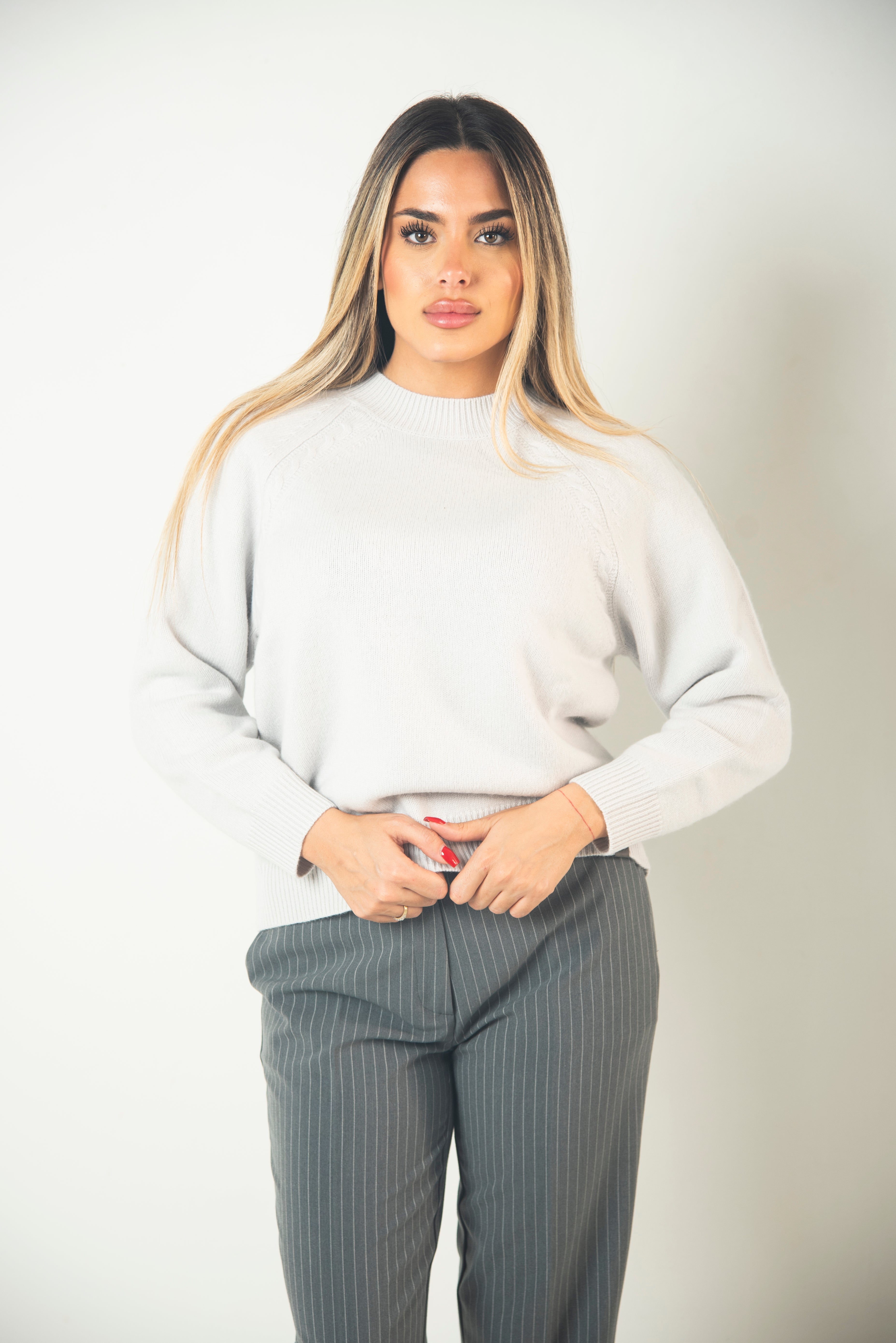 MAGLIONE CON TRECCE