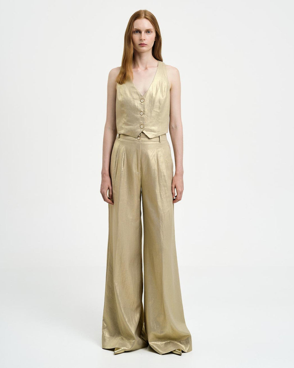 Pantaloni con piega effetto metallizzato